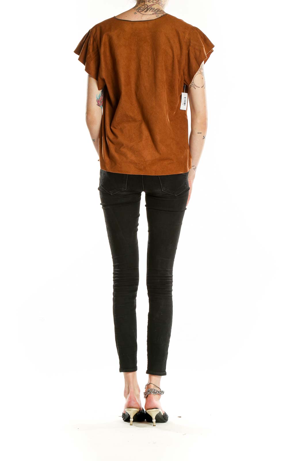 Back view of rust suede-like top showing relaxed fit and flutter sleeves