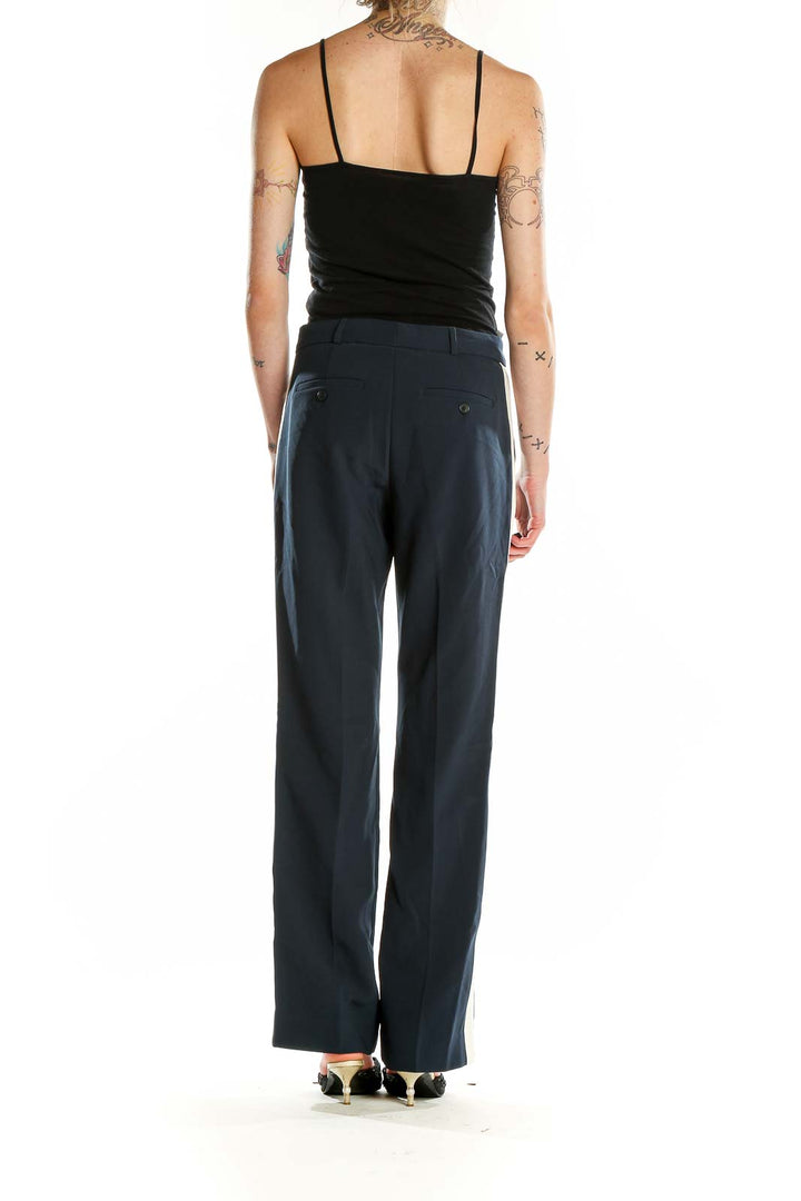 Back view of Banana Republic navy wide-leg dress pants showing rear welt pockets
