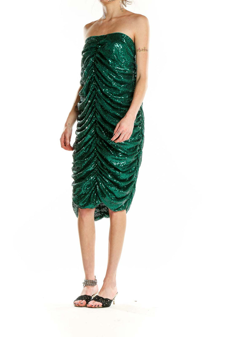 Front view of emerald green sequin strapless cocktail dress with ruched design