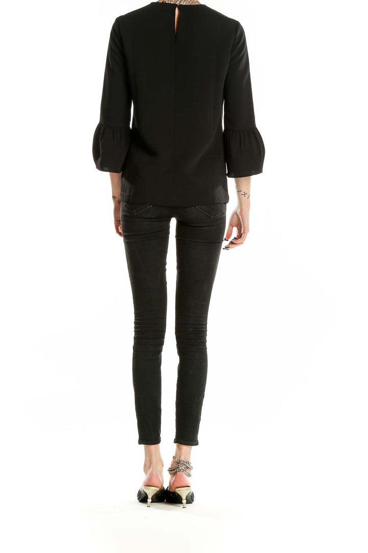 Back view of Madewell black polyester blouse showing relaxed fit