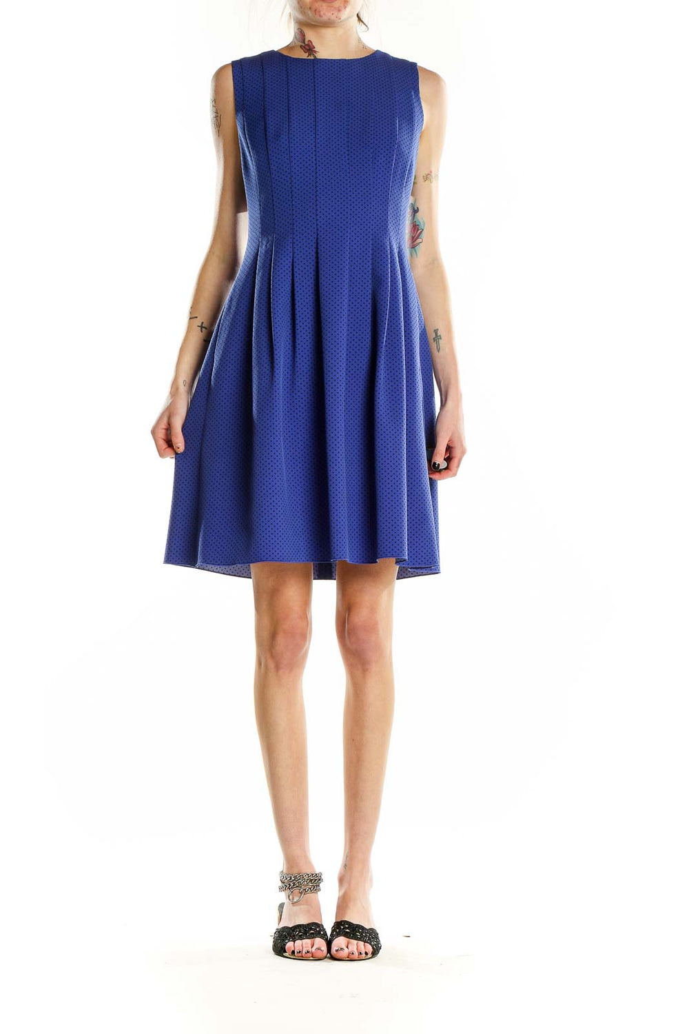 Front view of Anne Klein blue polka dot sleeveless dress with pleated skirt