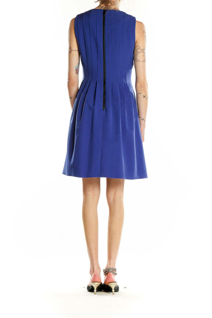 Back view of Anne Klein blue polka dot dress showing zipper closure
