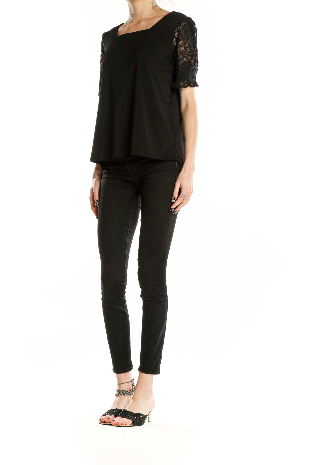 Front view of Adrianna Papell black top with lace puff sleeves and square neckline
