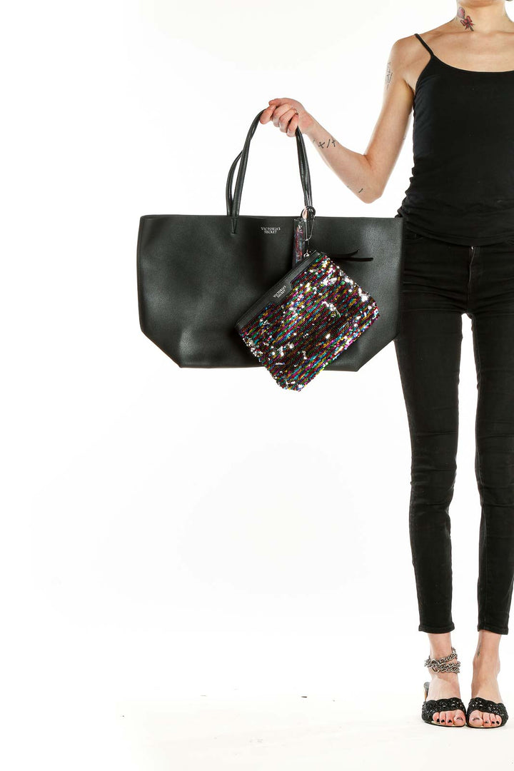 Front view of Victoria's Secret black leather tote with sequin pouch