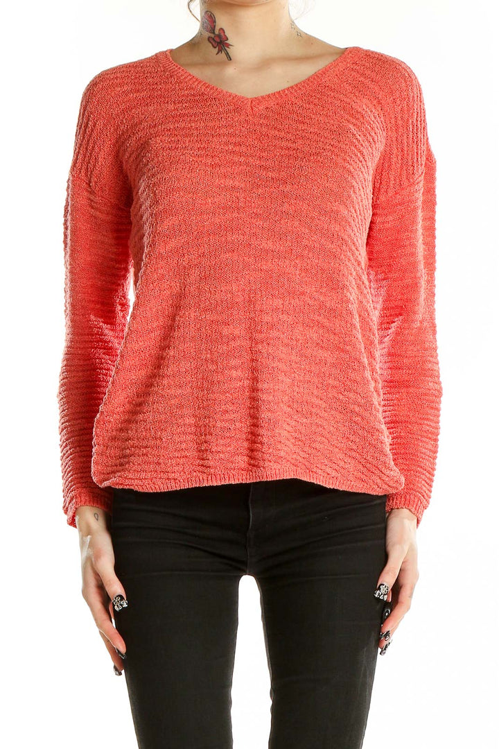 Front view of coral textured V-neck sweater by Calvin Klein Jeans