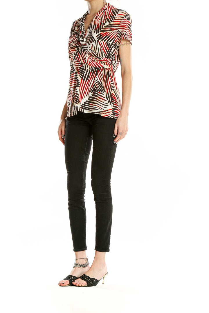 Front view of DKNY red and brown geometric print blouse with v-neck