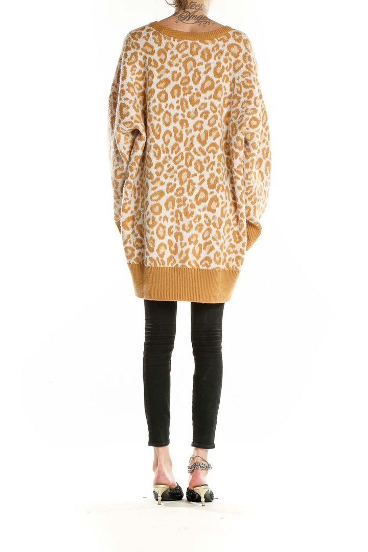 Back view of camel leopard print oversized sweater from Torrid