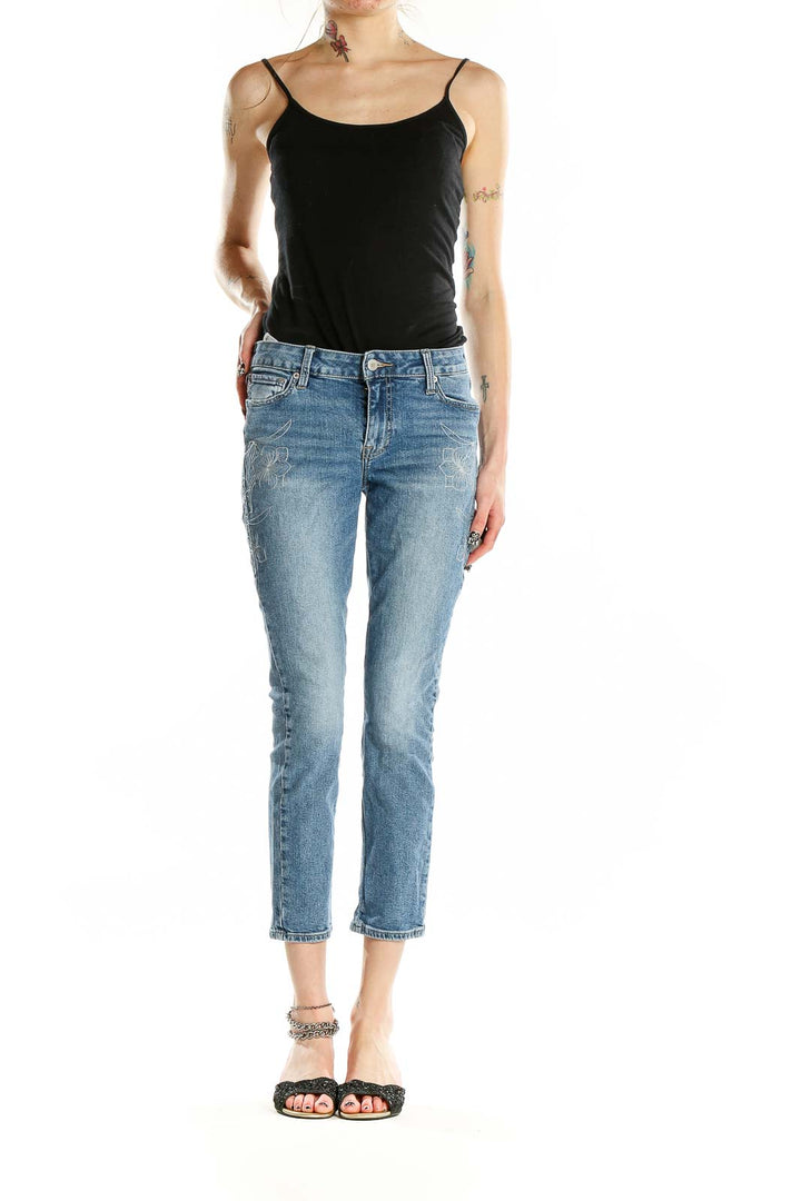 Front view of Lucky Brand blue distressed cropped jeans on model
