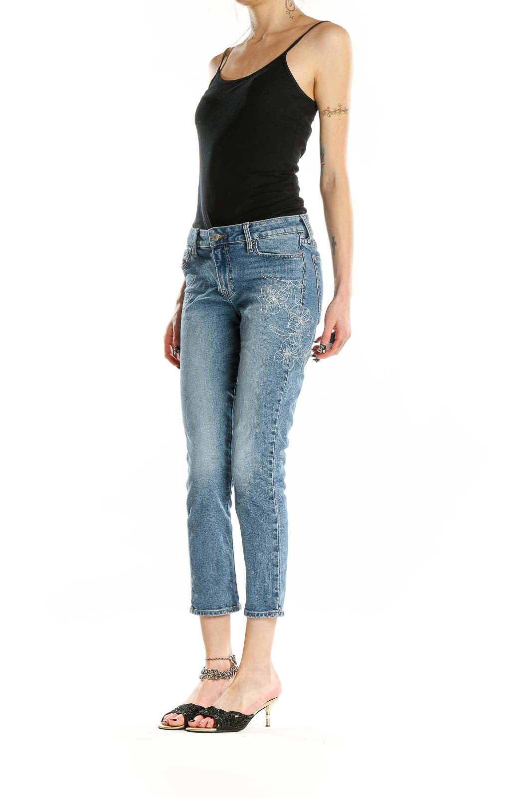 Front view of Lucky Brand blue distressed cropped jeans on model