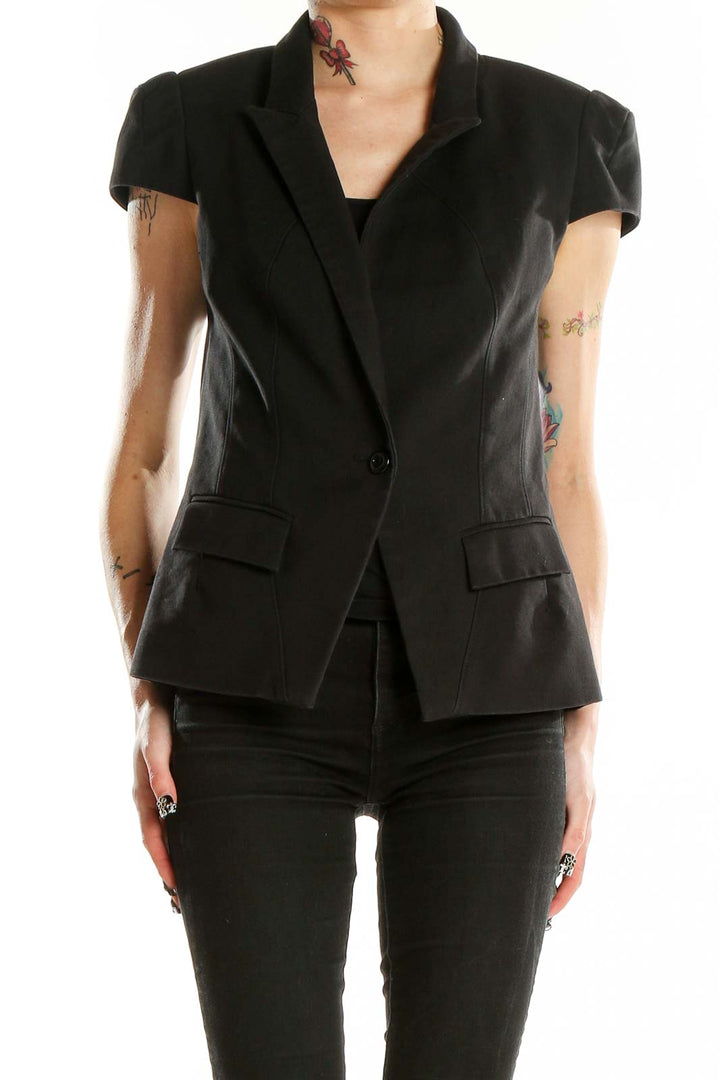Front view of black cap sleeve blazer from Bebe