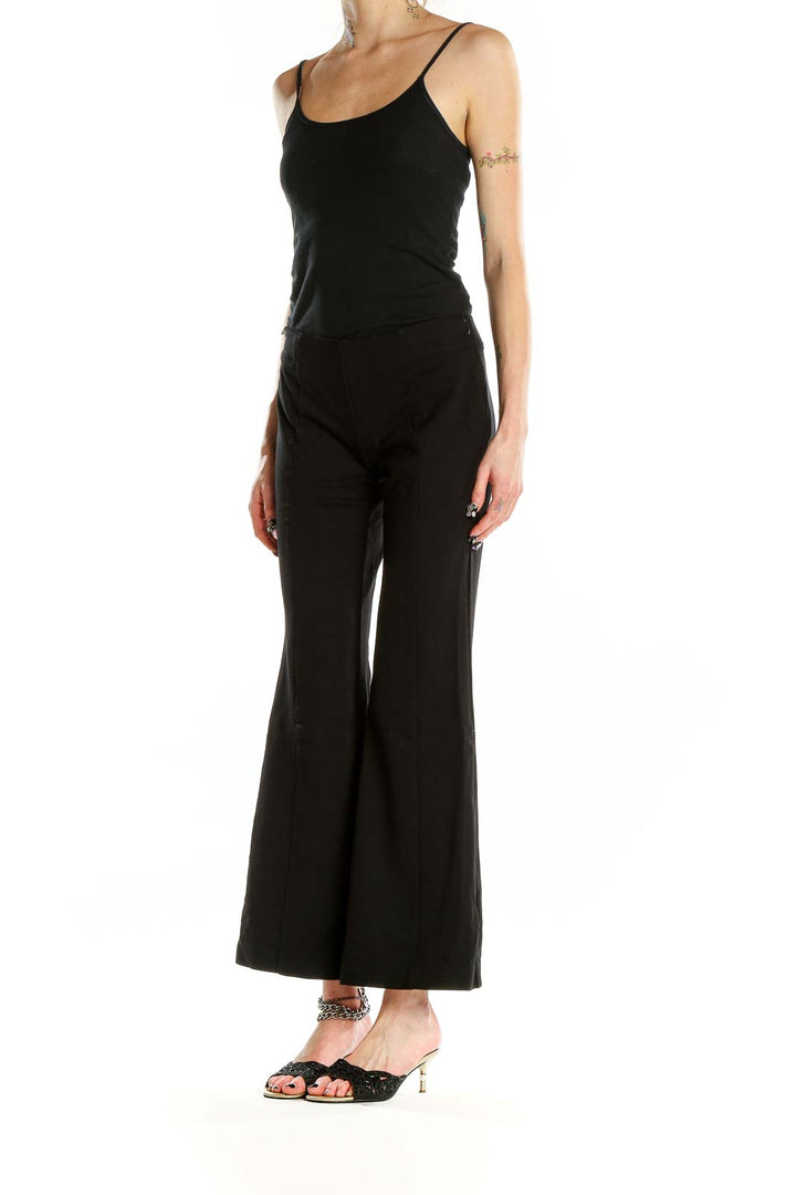 Front view of INC black wide-leg flare pants on model