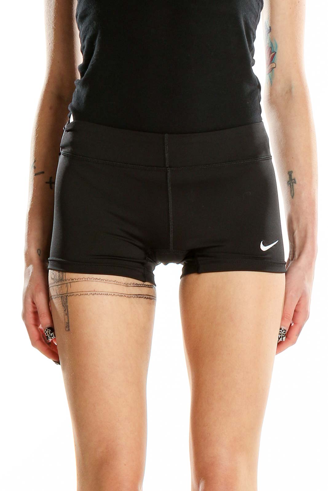 Front view of black Nike performance shorts on model