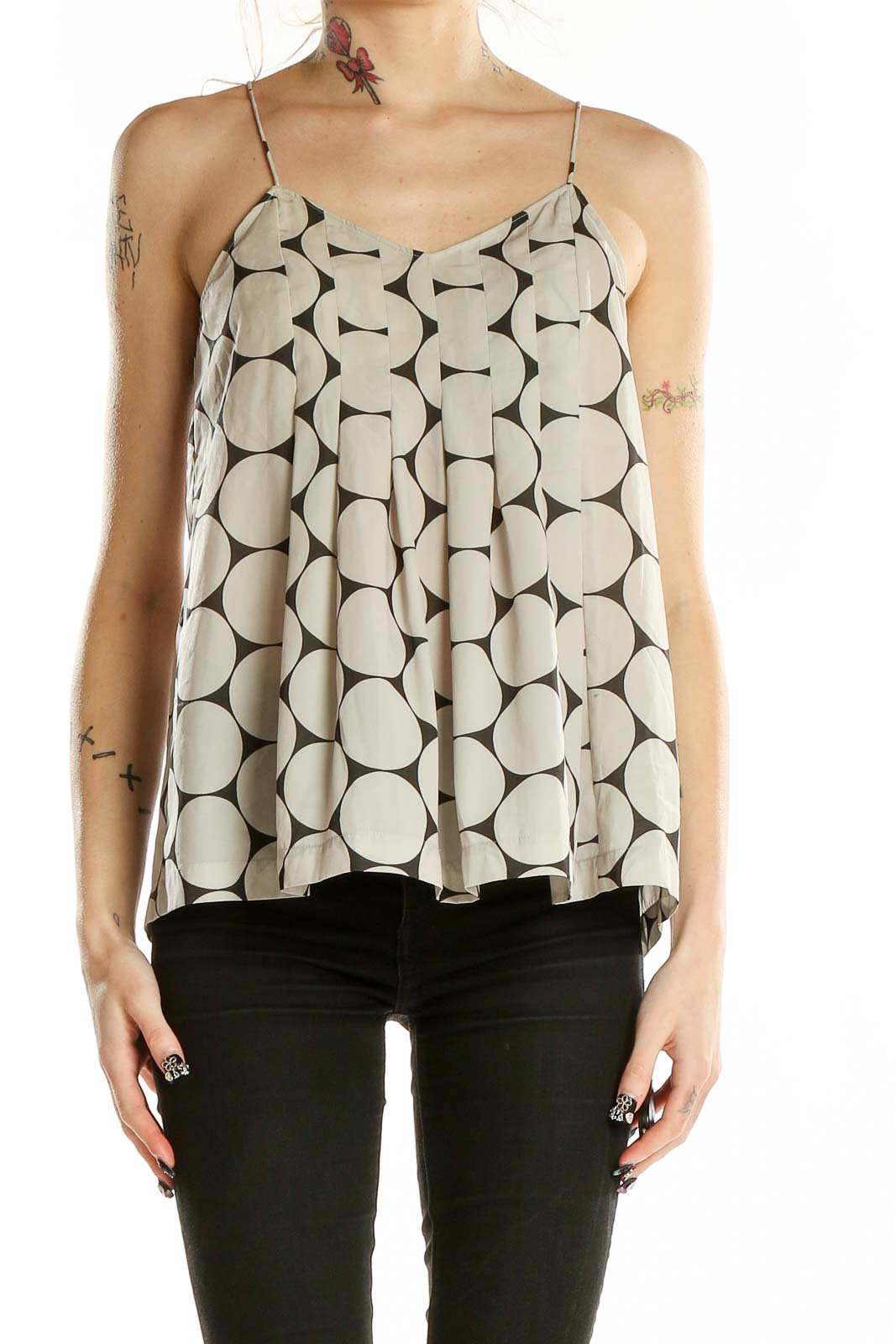 Front view of Madewell beige camisole top with large black polka dots