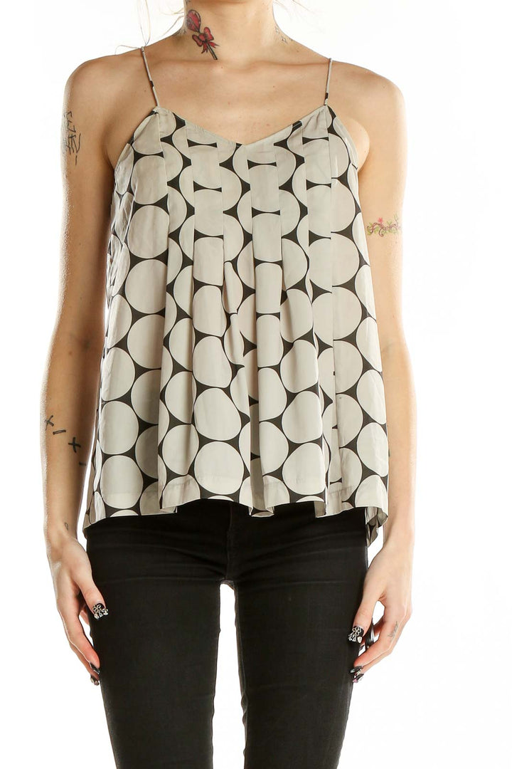Front view of Madewell beige camisole top with large black polka dots