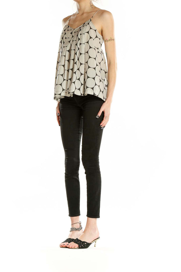 Front view of Madewell beige camisole top with large black polka dots