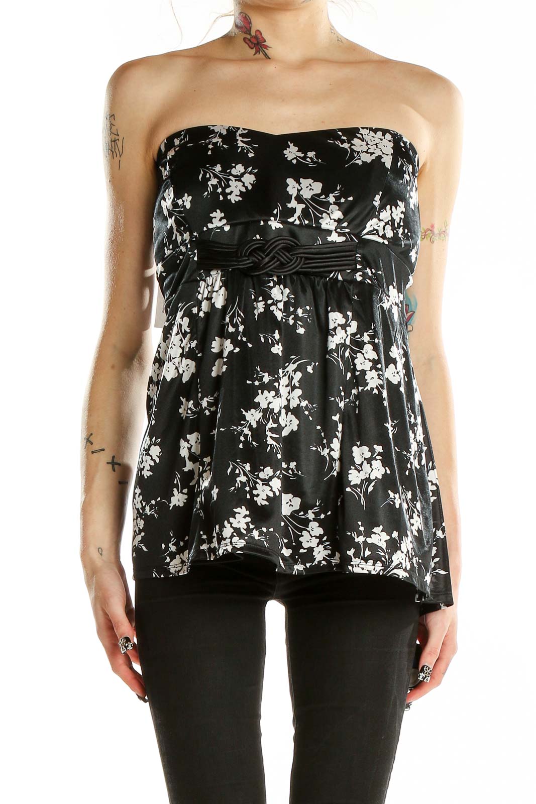 Front view of Torrid black strapless top with white floral print and empire waist