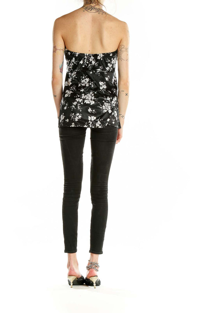 Back view of Torrid black strapless top with white floral print