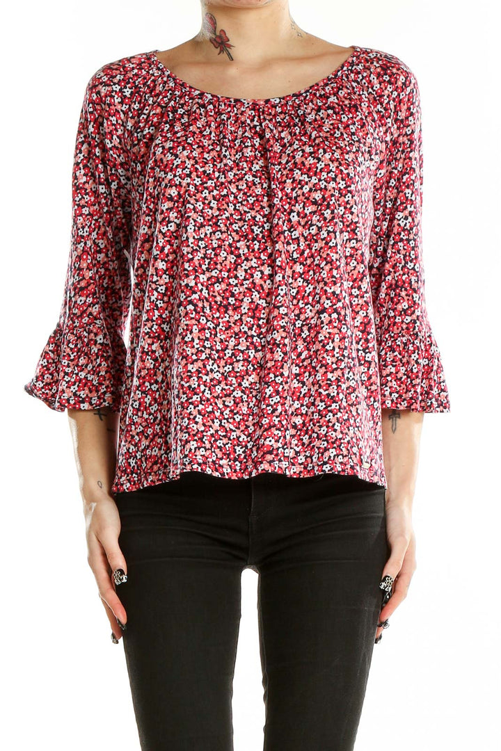 Front view of MICHAEL Michael Kors red floral print blouse with bell sleeves