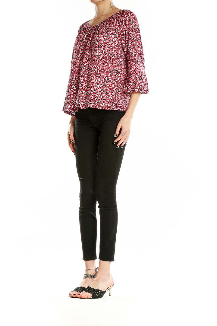Front view of MICHAEL Michael Kors red floral print blouse with bell sleeves