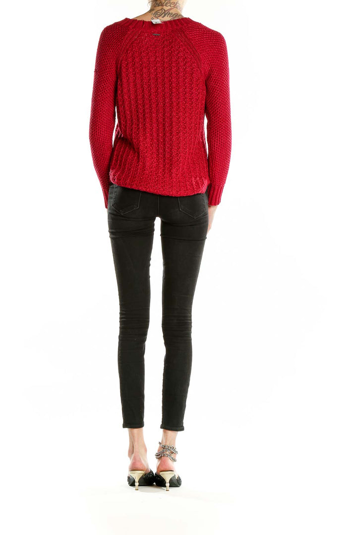 Back view of red chunky knit sweater by Calvin Klein Jeans