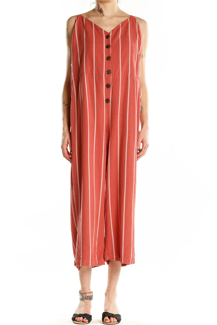 Front view of coral striped Gap jumpsuit with button-front closure