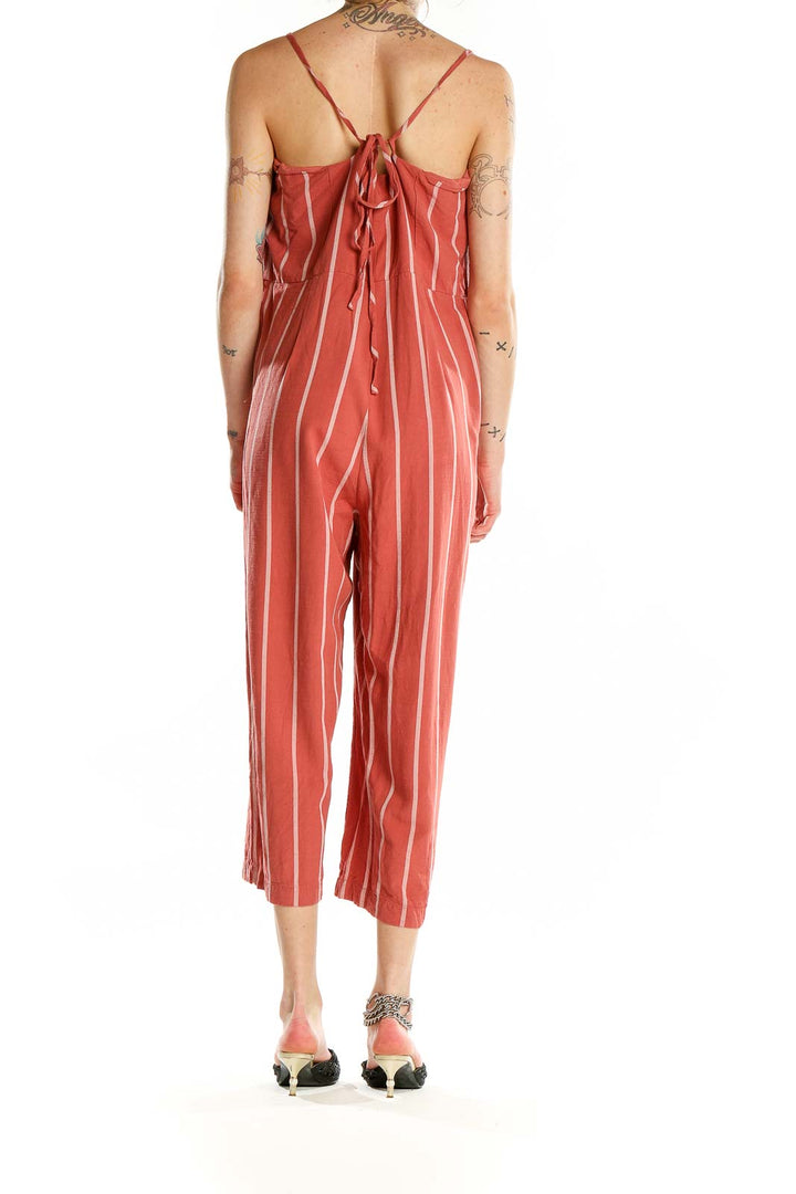 Back view of coral striped Gap jumpsuit showing tie detail