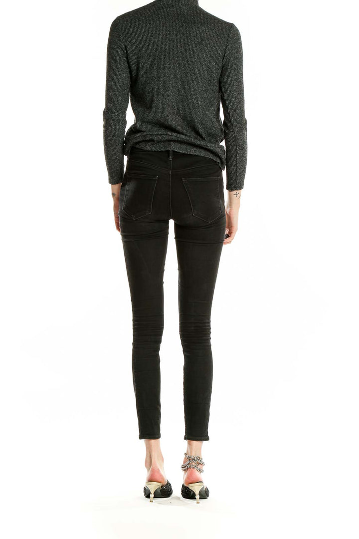 Back view of Nine West charcoal mock neck top with black pants on model