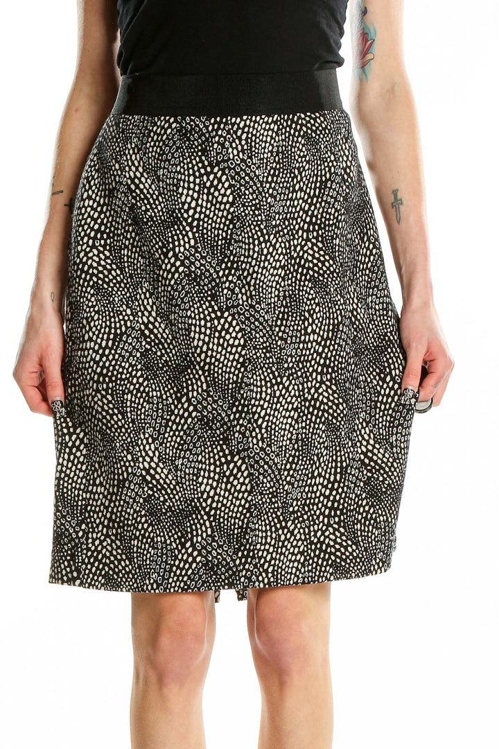 Front view of Ann Taylor black and white dotted A-line skirt
