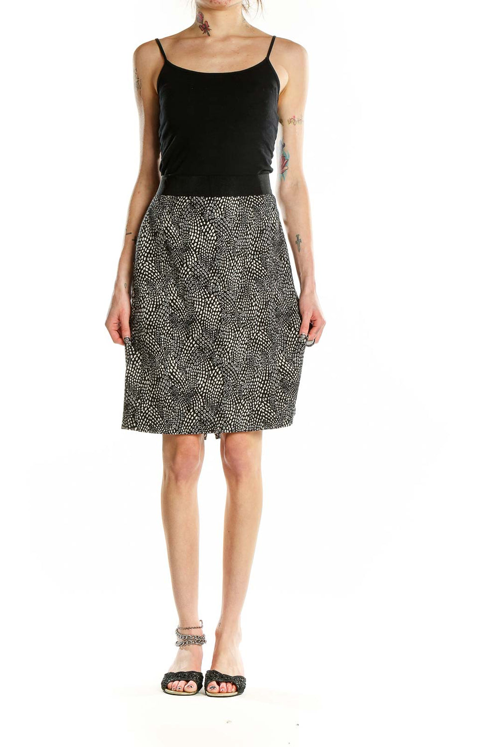 Front view of Ann Taylor black and white dotted A-line skirt