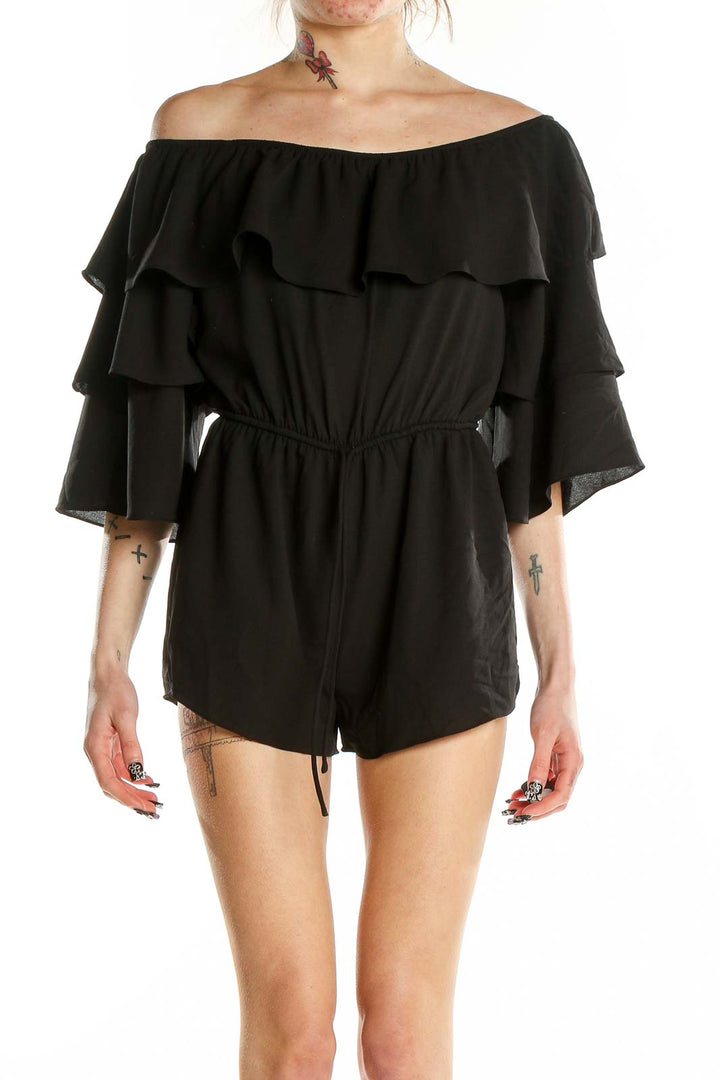 Front view of Honey Belle black off-shoulder romper with ruffles and bell sleeves