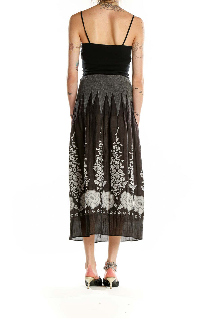 Back view of Lapis black midi skirt showing floral pattern and fit