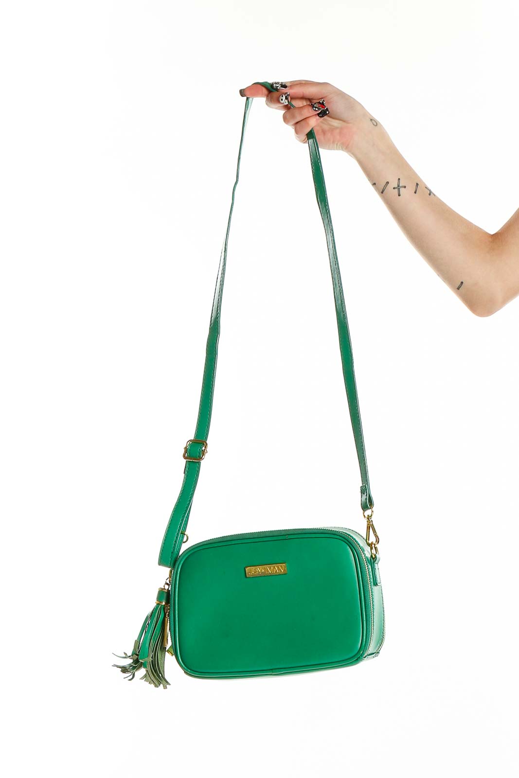 Front view of Joy & Iman green leather crossbody bag with tassel