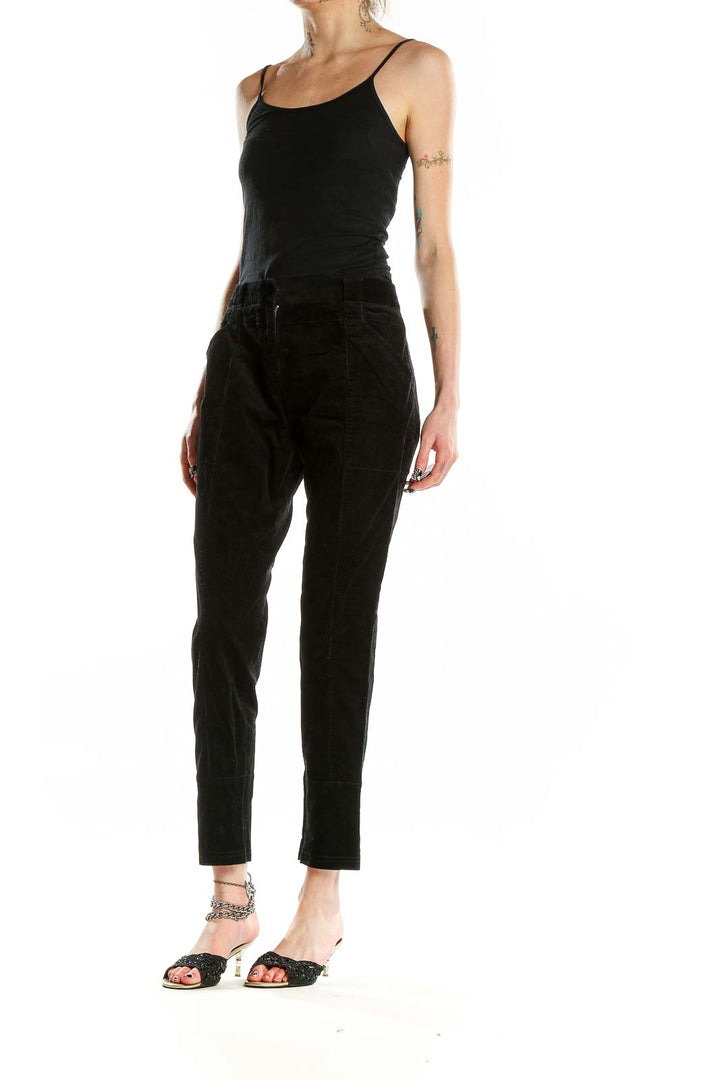 Front view of Proenza Schouler black tailored trousers with side pockets