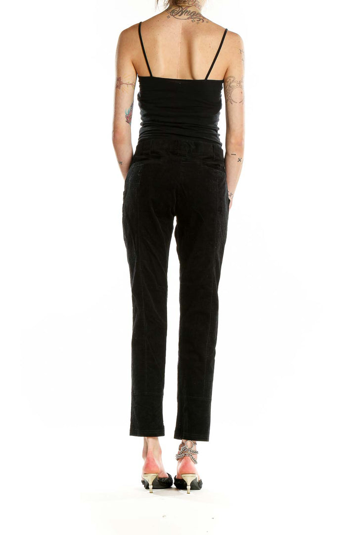 Back view of Proenza Schouler black tailored trousers on model