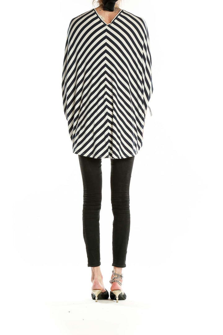 Back view of Nicole Miller Artelier Black and White Striped Batwing Top showing high-low hemline