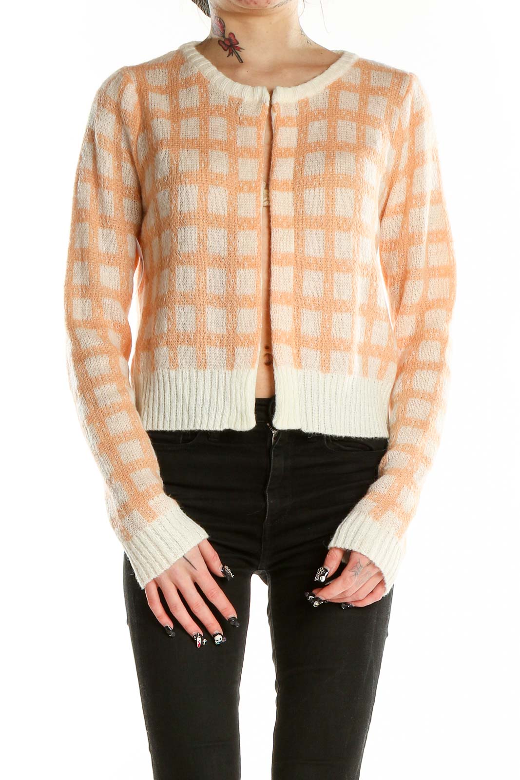 Front view of Calista peach checkered cropped cardigan with button closure