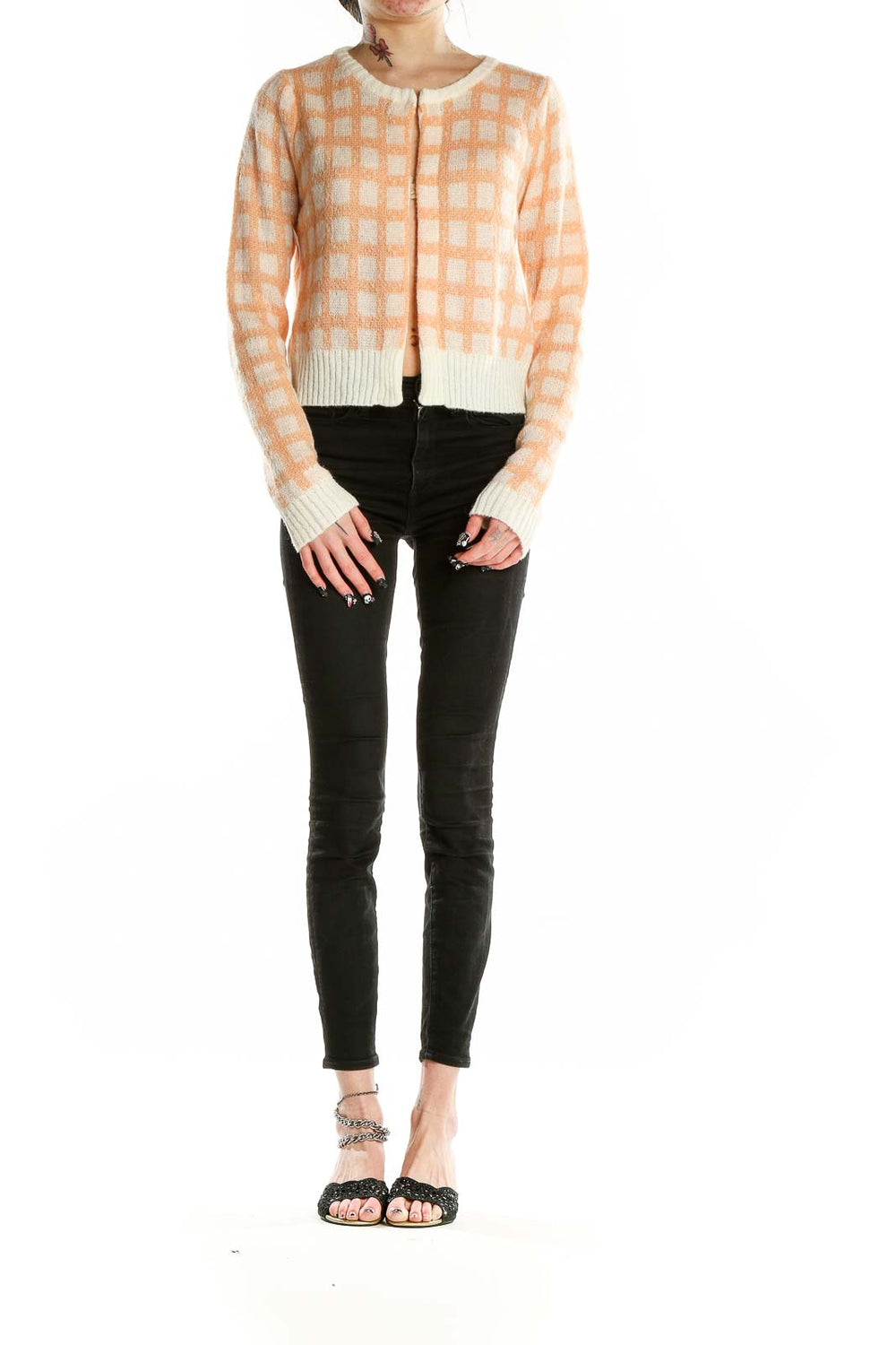 Front view of Calista peach checkered cropped cardigan with button closure