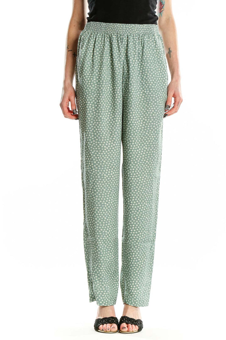 Front view of sage green polka dot rayon pants by Jeni Marque