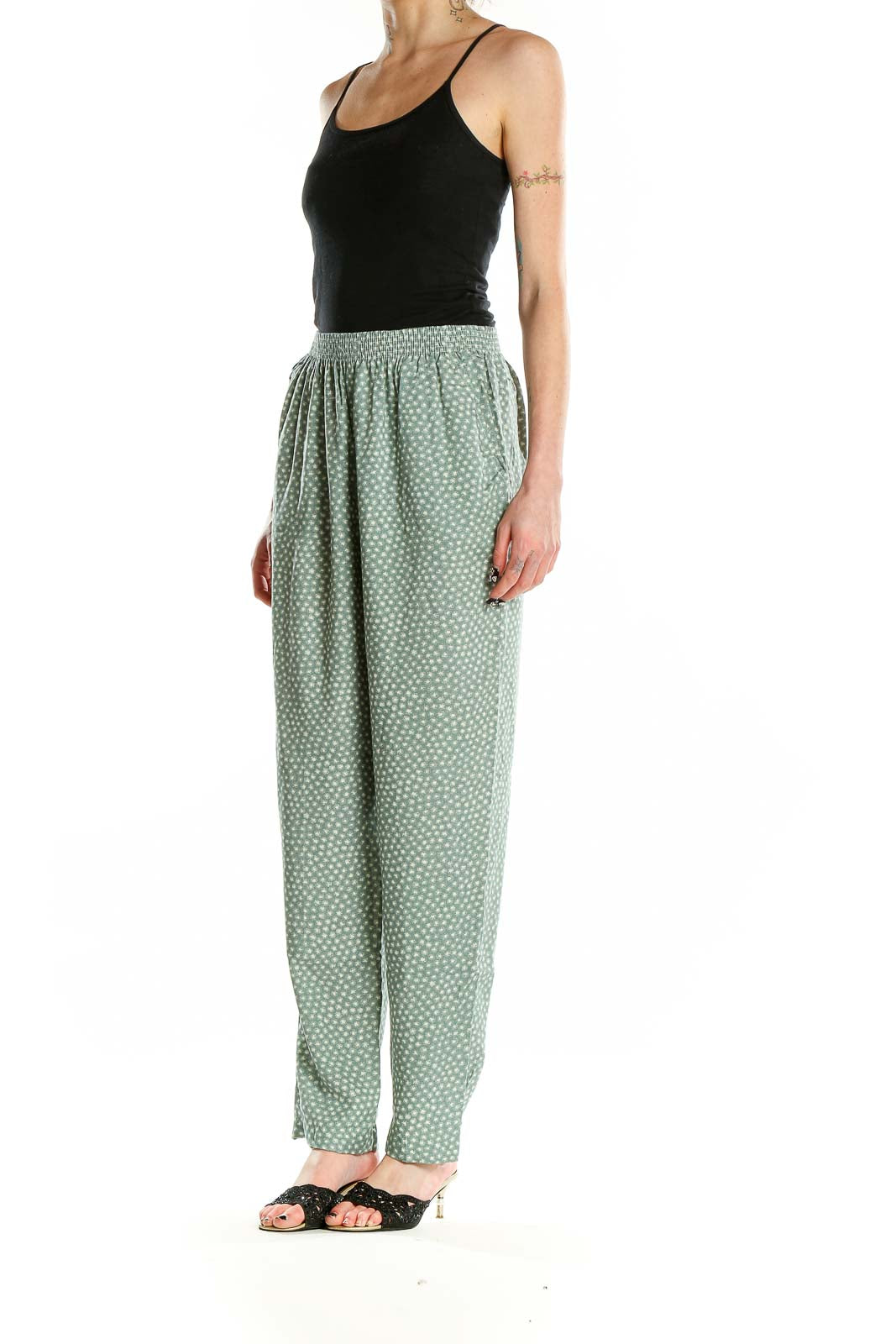 Front view of sage green polka dot rayon pants by Jeni Marque