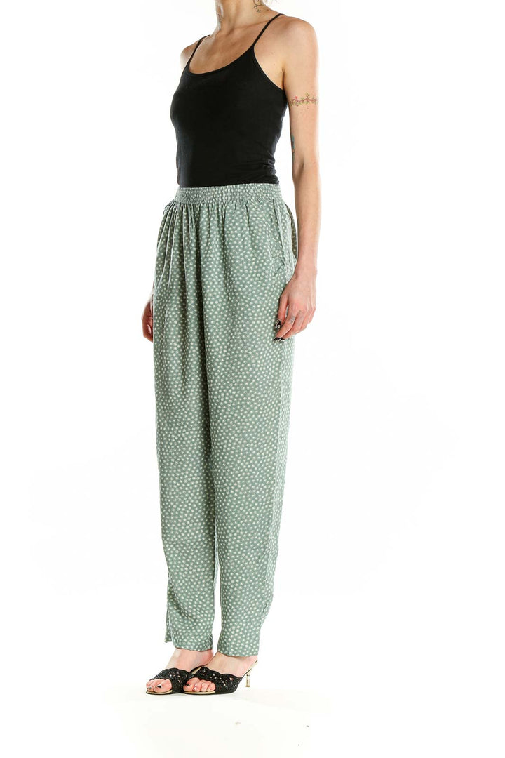 Front view of sage green polka dot rayon pants by Jeni Marque