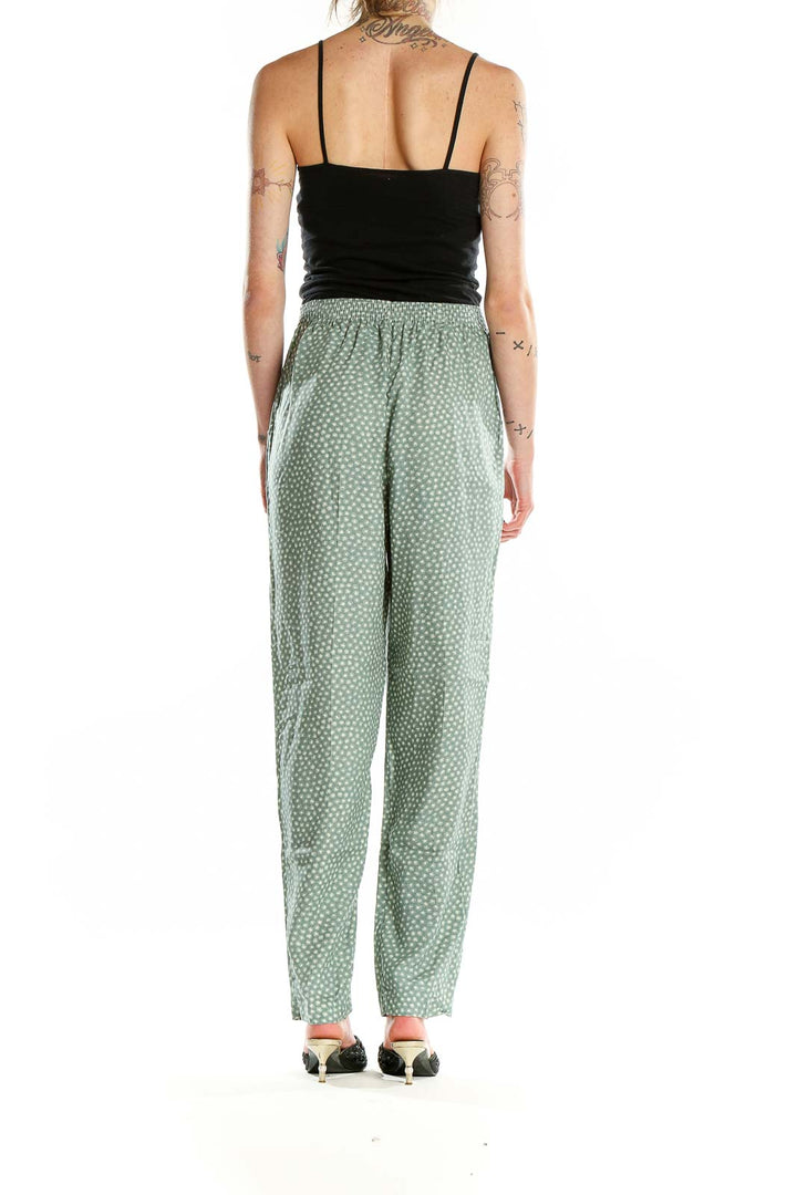 Back view of sage green polka dot rayon pants by Jeni Marque