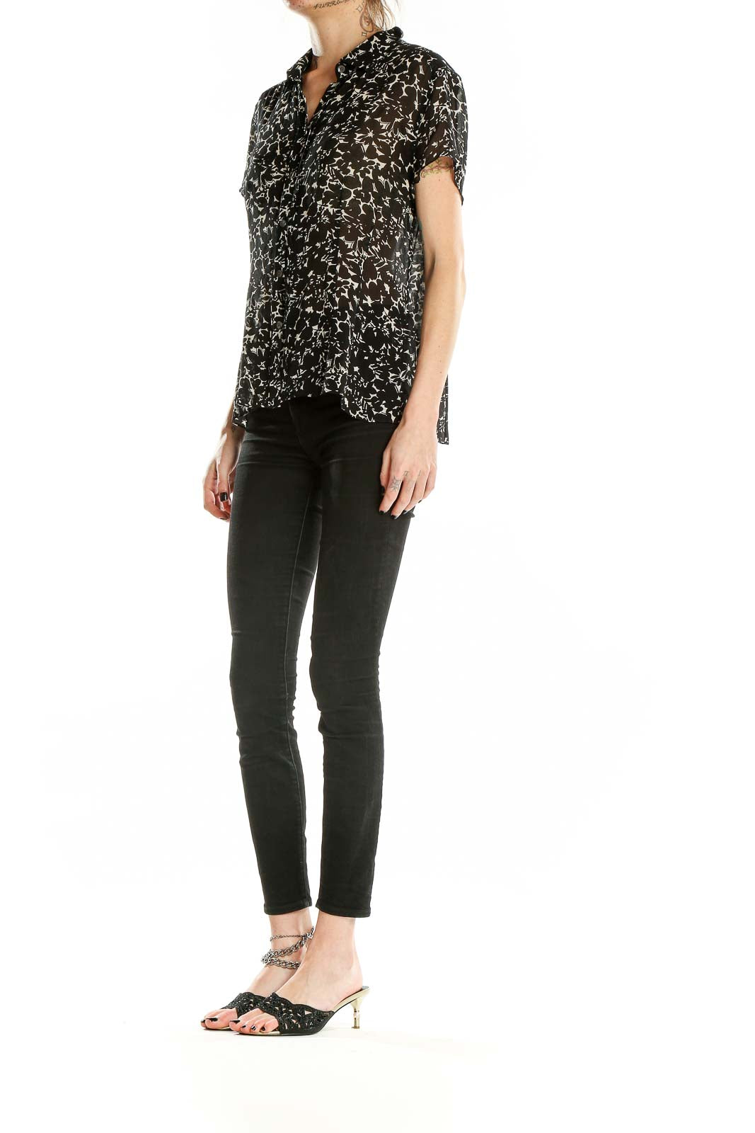 Front view of Ann Taylor black silk blouse with white floral print