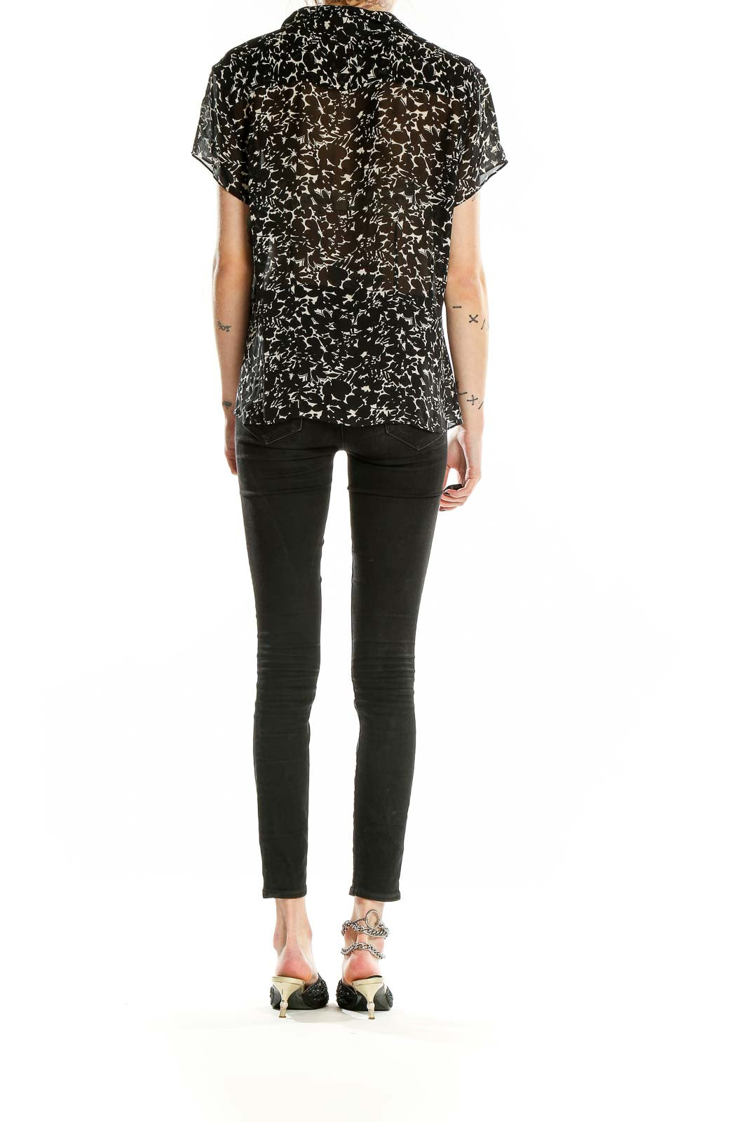 Back view of Ann Taylor black silk blouse with white floral print