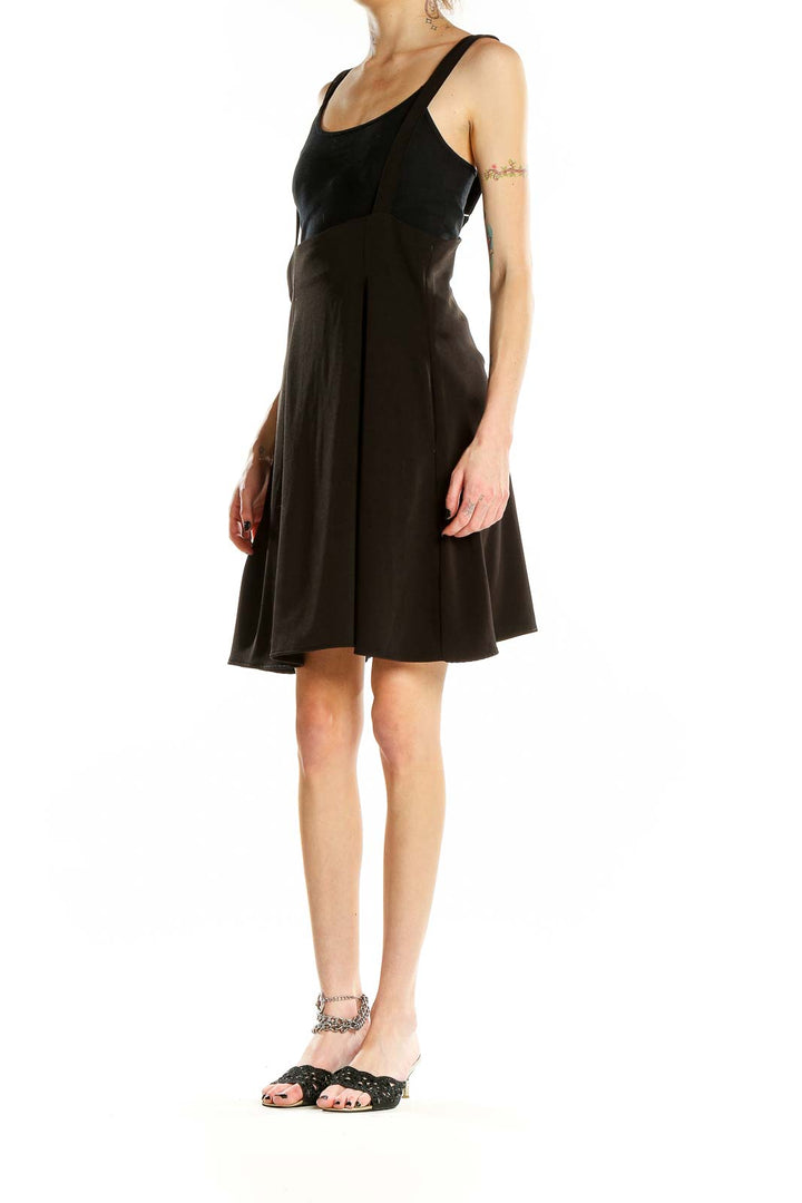 Front view of ModCloth black flared suspender skirt on model