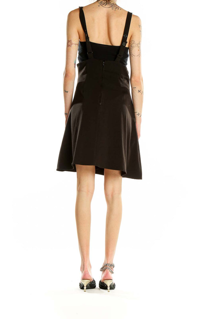 Back view of ModCloth black flared suspender skirt on model