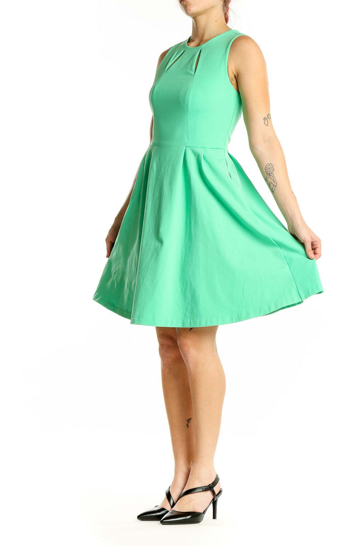 Front view of Cynthia Rowley mint green sleeveless fit-and-flare dress with cutout neckline