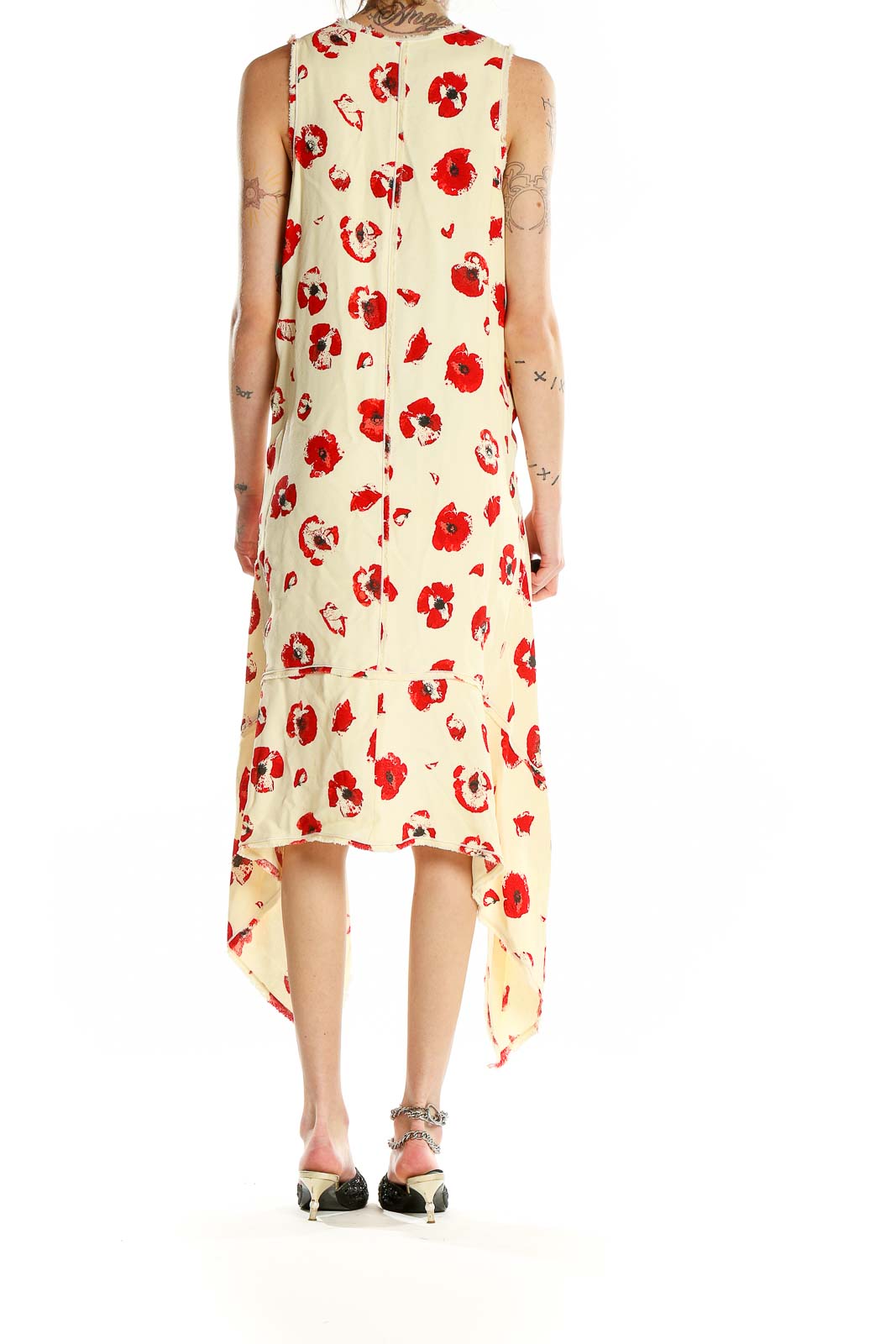 Back view of Proenza Schouler cream sleeveless dress showing floral print and high-low design