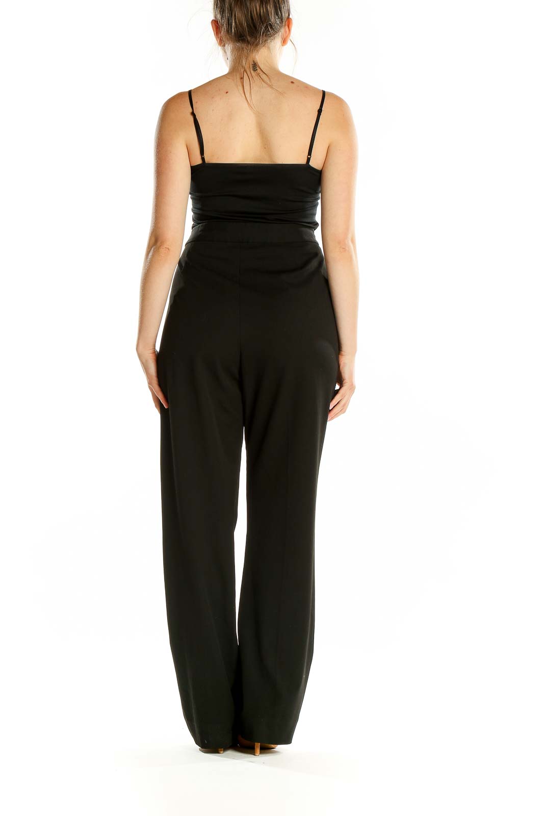 Back view of black wide-leg dress pants on model