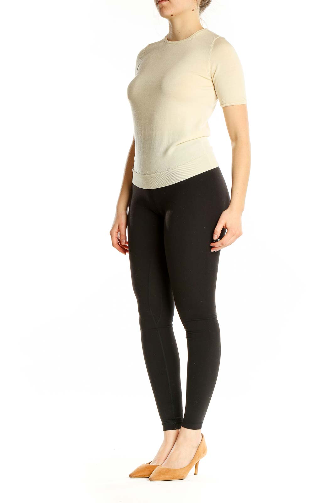 Front view of Uniqlo cream short-sleeve wool sweater on model