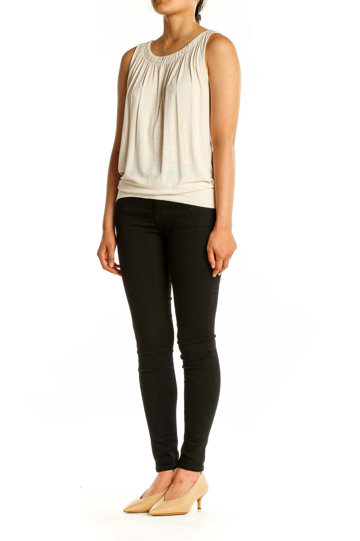 Front view of cream sleeveless gathered neck top from LOFT Outlet